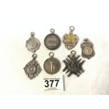 SEVEN HALLMARKED SILVER SPORTING PENDANTS, TWO FOOTBALL, TWO CRICKET, TWO CYCLING AND ONE ARMY