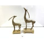 A PAIR OF ART DECO STYLE SILVERED COMPOSITION MODELS OF ANTELOPES (THE LARGEST 44CMS)