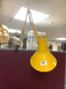 A VINTAGE 1960/70S YELLOW METAL CLAMP ON HCF DENMARK ANGLE POISE LAMP.
