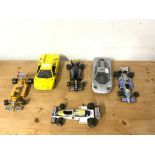 FOUR FORMULA ONE TOY CARS BY BURAGO AND TWO SPORTS CARS BY MAISTO