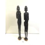 A PAIR OF TALL AFRICAN-CARVED HARDWOOD FIGURES OF MAN AND WOMAN 76 CM