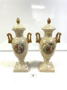 A PAIR OF ART DECO GILT DECORATED URN-SHAPED TWO-HANDLED VASES AND COVERS, WITH CLASSICAL MAIDEN