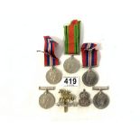 FIVE WORLD WAR II MEDALS AND TWO CAP BADGES