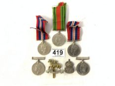 FIVE WORLD WAR II MEDALS AND TWO CAP BADGES