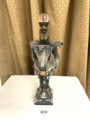 EGYPTOLOGY RESIN FIGURAL PIECE DECORATED WITH SNAKES STAND AND SWORD
