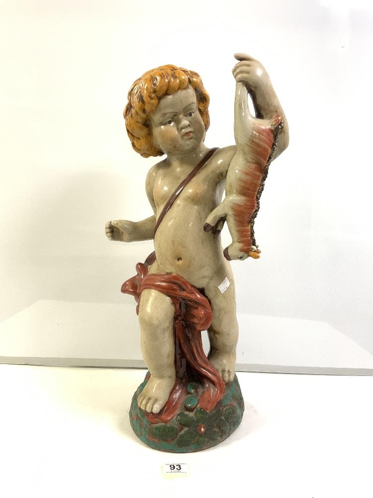 A LARGE STAFFORDSHIRE STYLE FIGURE OF A CHERUB HOLDING A GOAT 62 CM