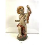 A LARGE STAFFORDSHIRE STYLE FIGURE OF A CHERUB HOLDING A GOAT 62 CM