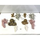 A GROUP OF 10 PORCELAIN AND PLASTER CHERUB WALL FIGURES