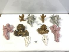 A GROUP OF 10 PORCELAIN AND PLASTER CHERUB WALL FIGURES