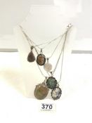 SIX SILVER AND HARDSTONE SET PENDANTS ON CHAINS