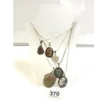 SIX SILVER AND HARDSTONE SET PENDANTS ON CHAINS