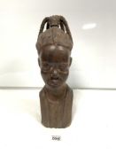 A CARVED HARDWOOD FIGURE OF AN AFRICAN TRIBESWOMEN, 40CM HIGH