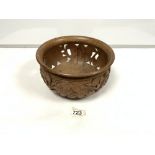 A WOODEN CARVED BOWL DECORATED WITH FLOWERS AS AN OPEN WORKED BOWL 25 CMS DIAMETER