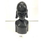 AN EBONISED BUST OF A FEMALE, 34CMS HIGH