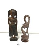 A RESIN FIGURE OF A LADY HOLDING HER HAIR 37 CMS WITH A CARVED WOODEN LADY FIGURE 43 CM HIGH