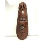 A LARGE RED WOOD CARVED MASK WITH ELEPHANT, FACE AND BLACK PIGMENT, DETAIL FROM BOTSWANA, 71CMS