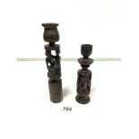 TWO CARVED WOODEN CANDLESTICKS LARGEST 25CM