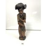LARGE CARVED FIGURE OF A MALE PLAYING THE DRUM, 52CMS