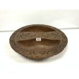 A CARVED WOODEN BOWL DECORATED THROUGHOUT WITH FLOWERS, 47CM DIAMETER