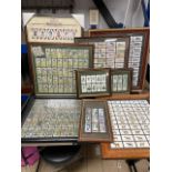 A QUANTITY OF CIGARETTE CARDS, CASED