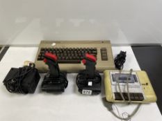 COMMODORE 64 WITH CZN CASSETTE, TWO JOYSTICKS AND LEADS