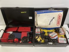 TWO METAL BOXES OF VINTAGE MECCANO, INCLUDES WHEELS, PULLEYS, INSTRUCTIONS, AND MORE