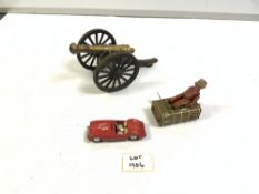 VINTAGE GERMAN TIN-PLATE BELLBOY WITH TRUNK, A BRONZE CANON, AND A CORGI MGA