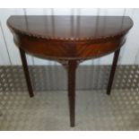 A mahogany demilune card table with beaded borders on tapering rectangular legs, 76 x 83 x 41cm