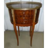 An inlaid mahogany oval side table with pierced gallery and three drawers on cabriole legs, 72 x