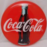 A circular perspex Coca Cola decal, 80.5cm (d)