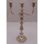 A Victorian silver plated three branch candelabrum, the knopped stem chased with flowers and