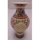 A Chinese baluster vase with pierced sides decorated with flowers and leaves, marks to the base,