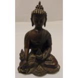 An oriental bronze Buddha in customary seated form, 22cm (h)