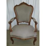 A French style carved mahogany occasional chair with upholstered seat and back on cabriole legs