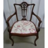 An early 20th century mahogany occasional armchair with pierced back on cabriole legs