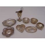 A quantity of hallmarked silver to include a George III cream jug, A Victorian salt cellar, a pair