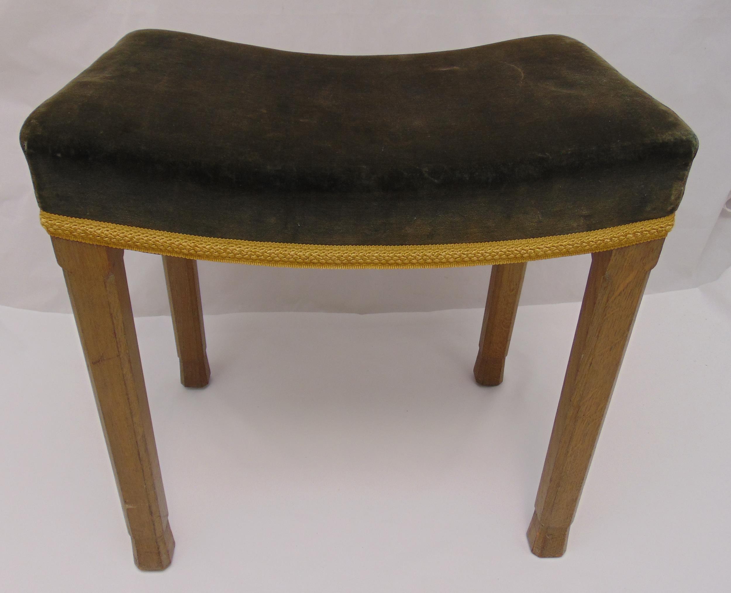 A Queen Elizabeth II Coronation stool, upholstered on four tapering rectangular oak legs, stamped to