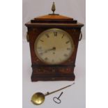 A Regency bracket clock, rectangular inlaid with brass detail, the circular enamel dial with Roman