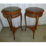 Two Continental mahogany circular side tables with gilded metal mounts and detachable marble tops,