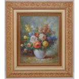 A framed oil on canvas still life of flowers, indistinctly signed bottom right, 60 x 49.5cm