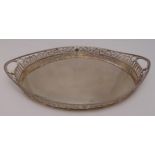 A Victorian hallmarked silver gallery tray, shaped oval with scroll pierced sides, inset side