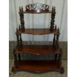 A Victorian mahogany rectangular four tier table top whatnot with barley twist column supports on