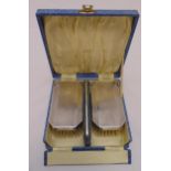 A cased hallmarked silver pair of gentlemans hairbrushes and matching comb in fitted case
