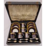 Aynsley coffee set in fitted case for six place settings to include silver holders and spoons