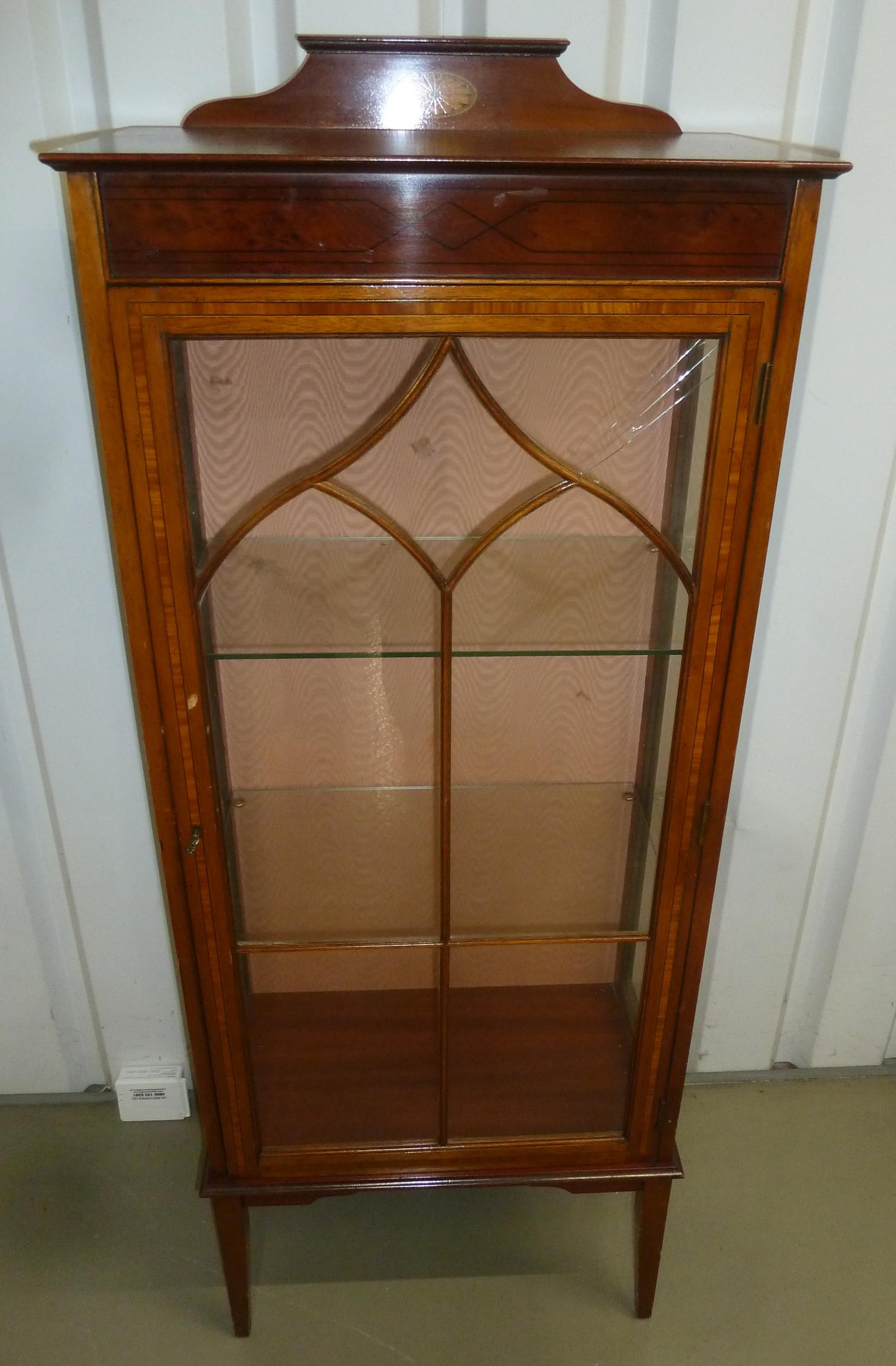 An Edwardian rectangular display cabinet, glazed hinged door on four tapering rectangular legs,