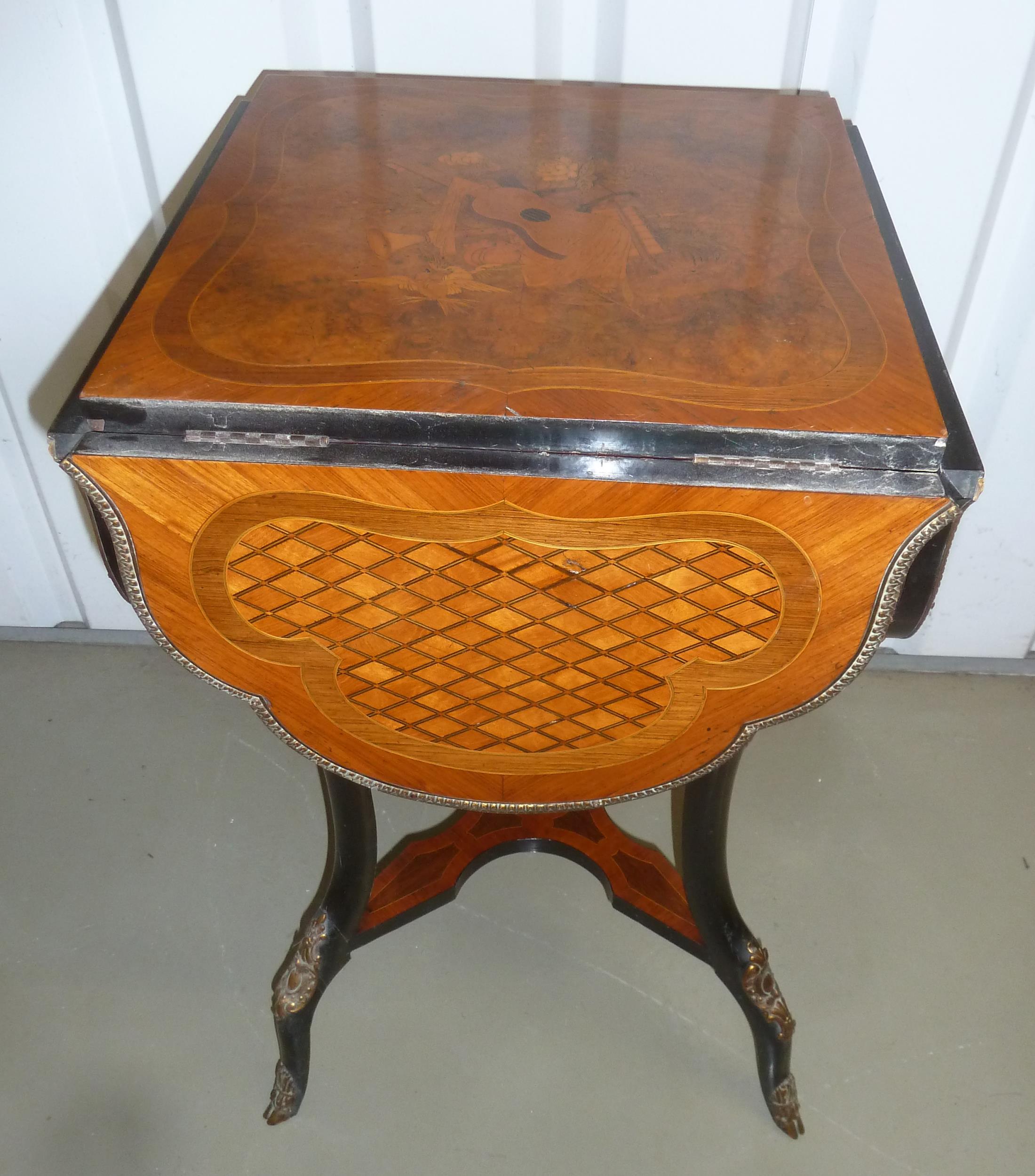 A continental quattrofoil tea table with hinged sides and decorative inlay on four cabriole legs, - Image 2 of 2