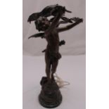 A bronze lamp stand figurine of a putti titled L’Attrait Dangereux, on raised circular marble