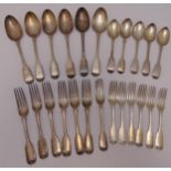 A quantity of Georgian and Victorian fiddle pattern hallmarked silver flatware to include a set of