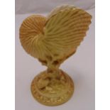 Royal Worcester blush yellow shell centrepiece, featuring a Nautilus chamber shell on coral stems