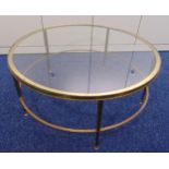 A late 20th century glass and gilded metal circular coffee table on five tapering cylindrical